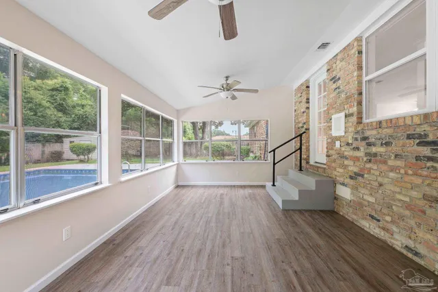a view of an entryway with wooden floor