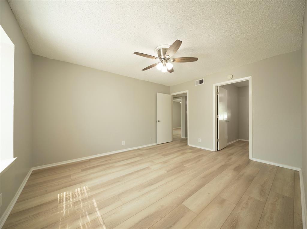 1717 North Locust Street, Unit 5 Denton, TX 76201 - Photo 2 of 11 a view of an empty room with a window