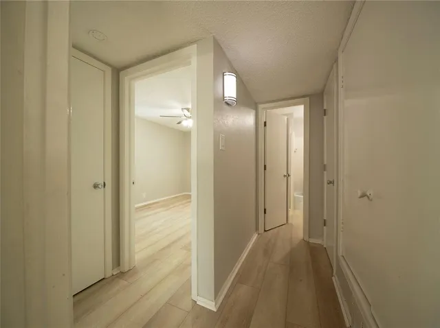 a view of a bathroom from a hallway