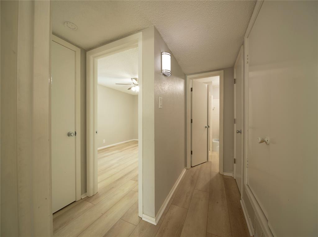 1717 North Locust Street, Unit 5 Denton, TX 76201 - Photo 4 of 11 a view of a bathroom from a hallway