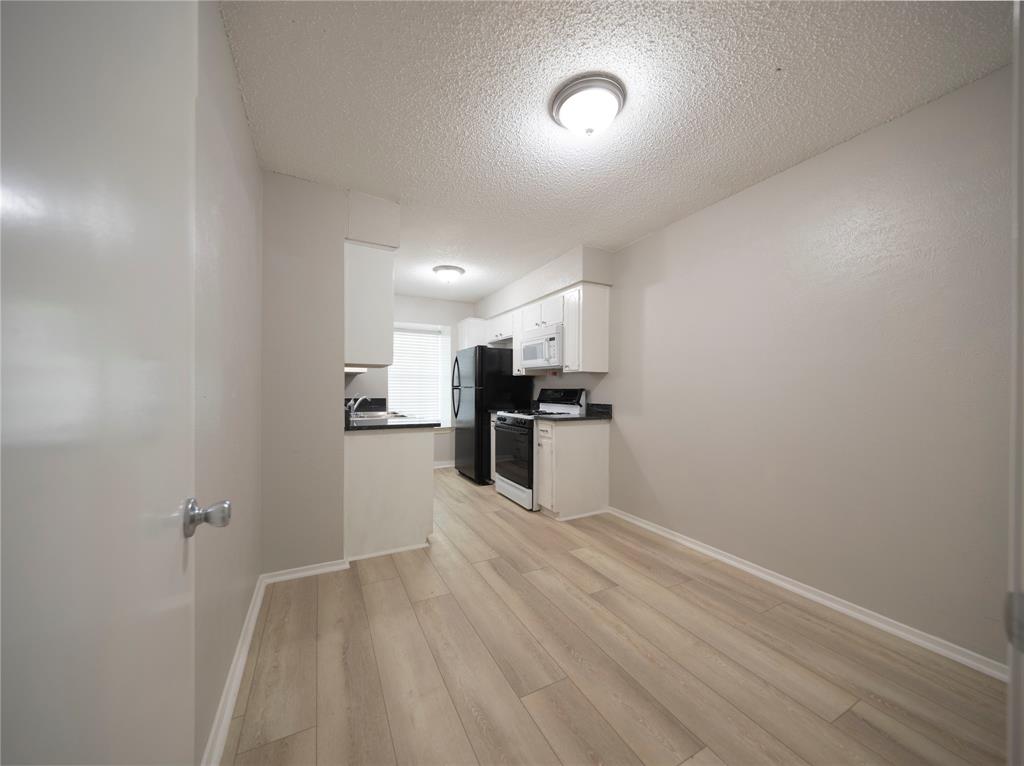 1717 North Locust Street, Unit 5 Denton, TX 76201 - Photo 9 of 11 a view of kitchen with sink