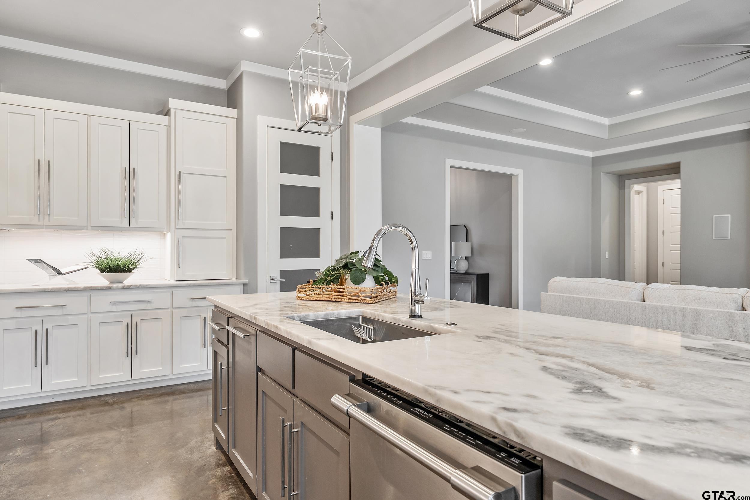 1569 Cooks Crossing Tyler, TX 75703 - Photo 12 of 39 a kitchen with granite countertop white cabinets and white appliances