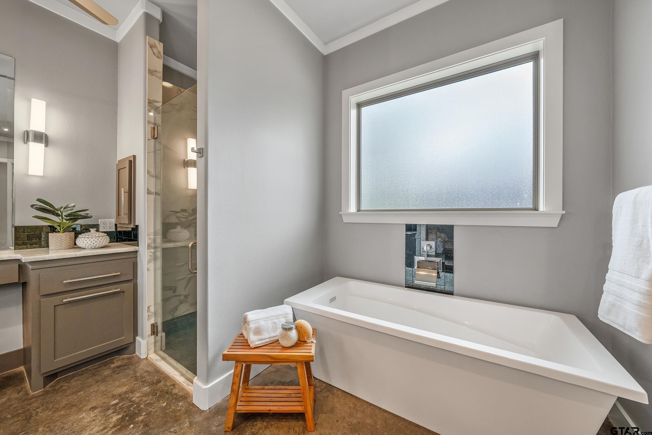 1569 Cooks Crossing Tyler, TX 75703 - Photo 19 of 39 a bathroom with a tub sink and mirror