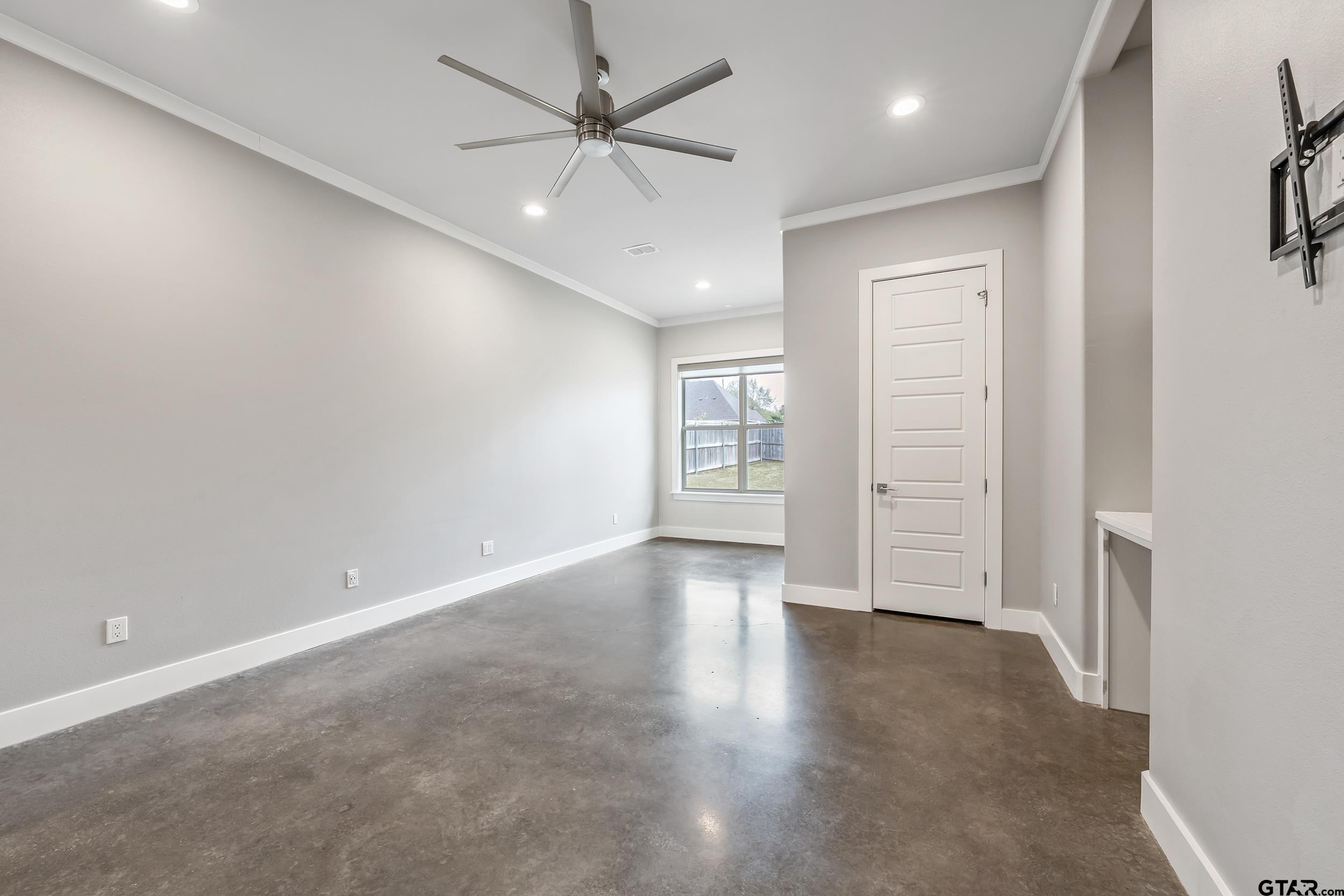 1569 Cooks Crossing Tyler, TX 75703 - Photo 24 of 39 wooden floor in an empty room with a window