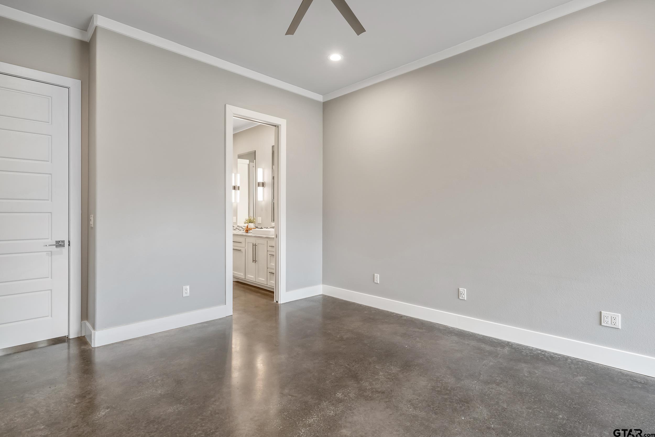 1569 Cooks Crossing Tyler, TX 75703 - Photo 26 of 39 an empty room with closet and a chandelier fan