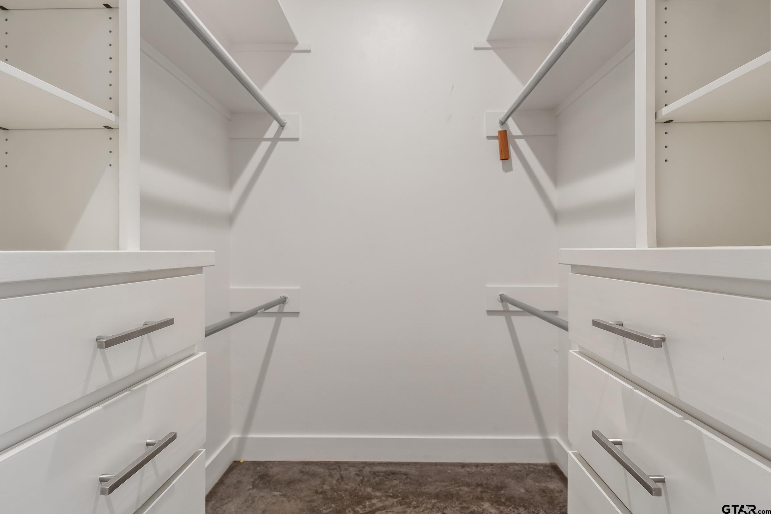 1569 Cooks Crossing Tyler, TX 75703 - Photo 27 of 39 a view of storage and utility room with racks on the wall