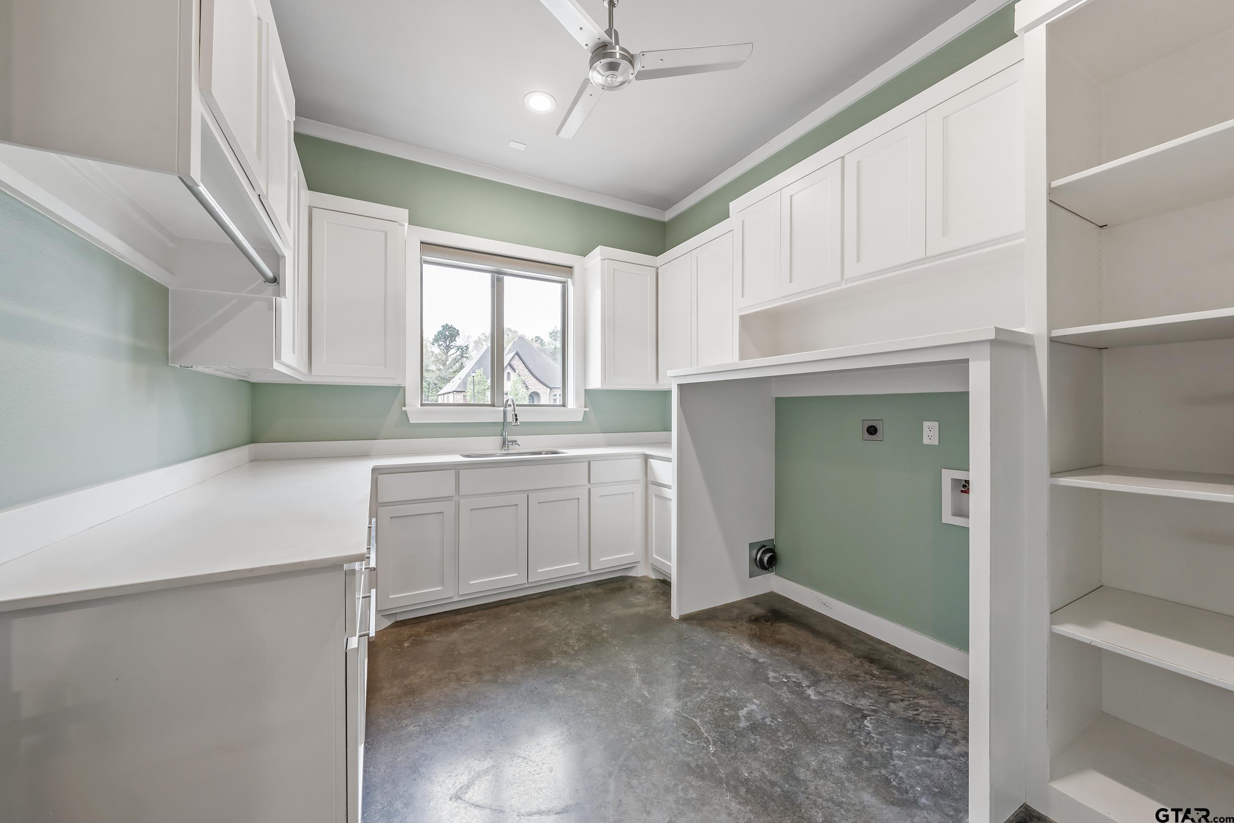 1569 Cooks Crossing Tyler, TX 75703 - Photo 33 of 39 a kitchen with white cabinets and white appliances
