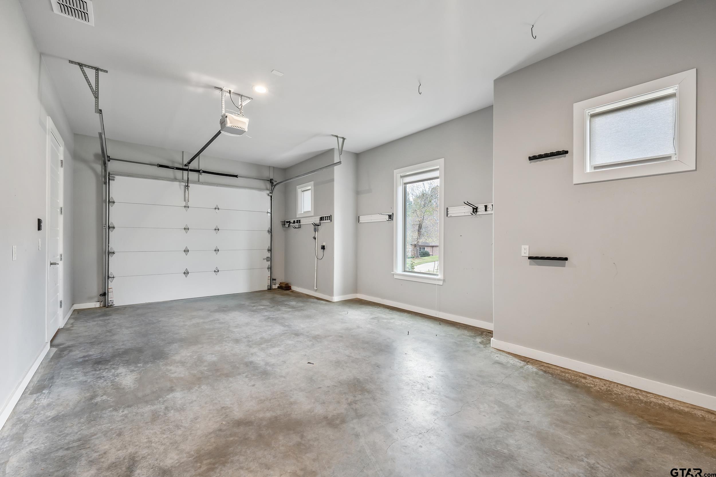 1569 Cooks Crossing Tyler, TX 75703 - Photo 36 of 39 an empty room with closet and mirrors