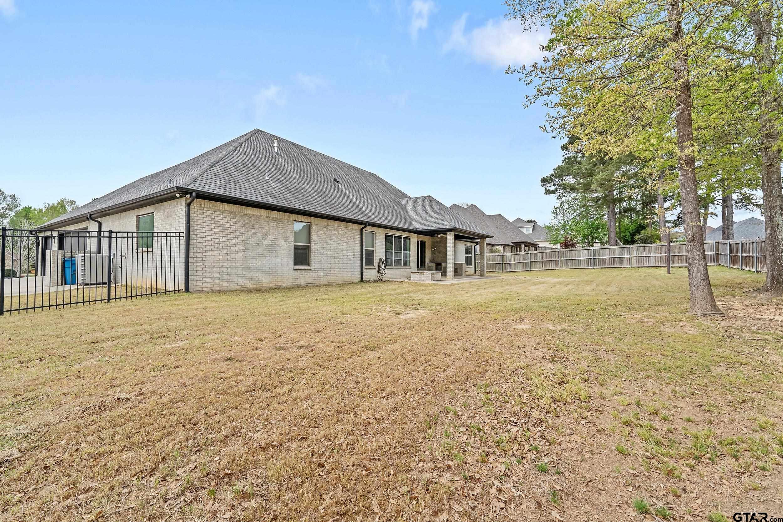 1569 Cooks Crossing Tyler, TX 75703 - Photo 37 of 39 a house with yard in front of it