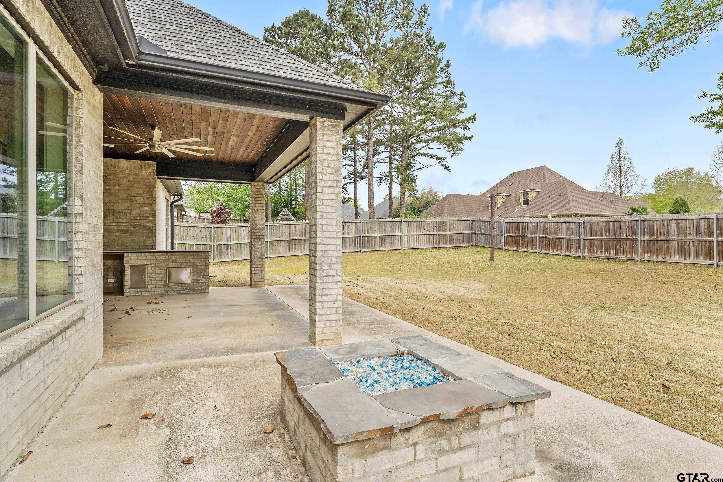 1569 Cooks Crossing Tyler, TX 75703 - Photo 39 of 39 a view of a swimming pool with a patio