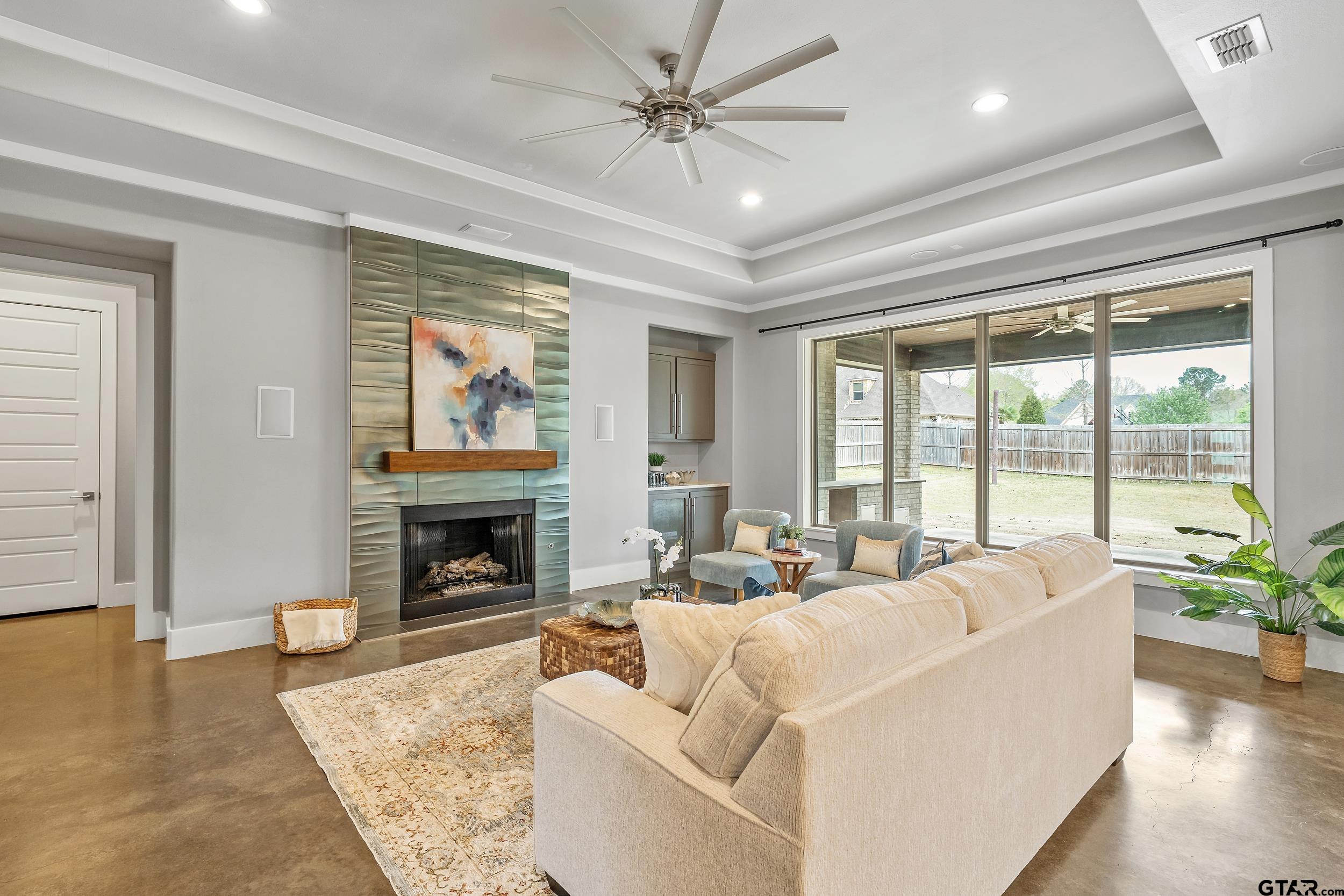 1569 Cooks Crossing Tyler, TX 75703 - Photo 8 of 39 a living room with furniture fireplace and a large window