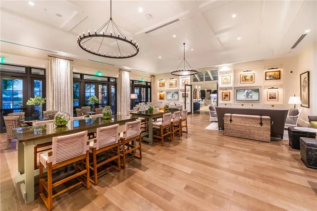 a living room with lots of furniture and kitchen view