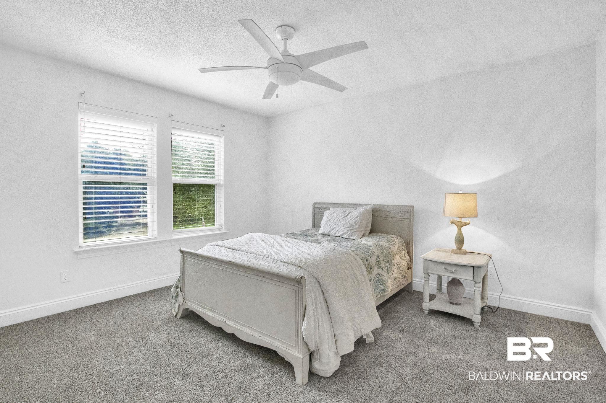 9002 Parliament Circle Daphne, AL 36526 - Photo 49 of 73 Carpeted bedroom with ceiling fan and a textured ceiling