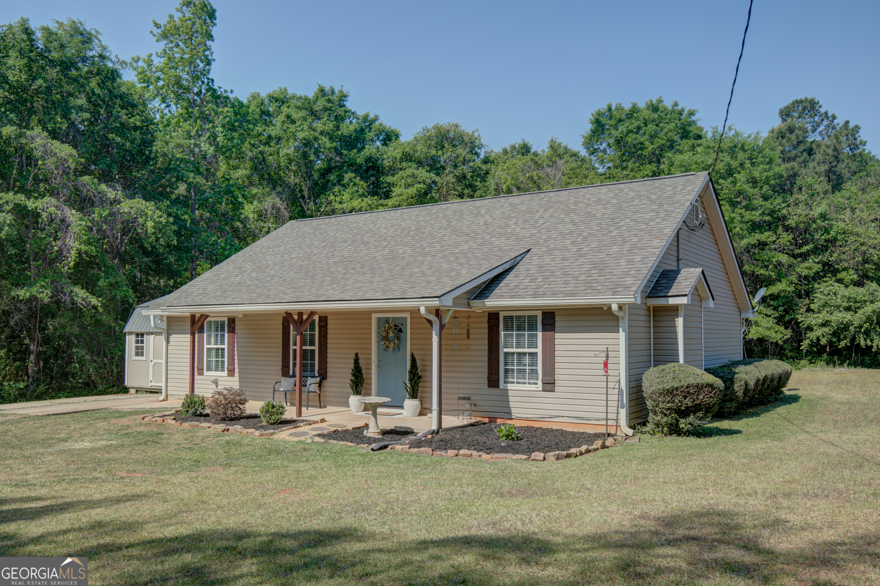 700 Spring Road Concord, GA 30206 - Photo 1 of 1 a front view of a house with a yard
