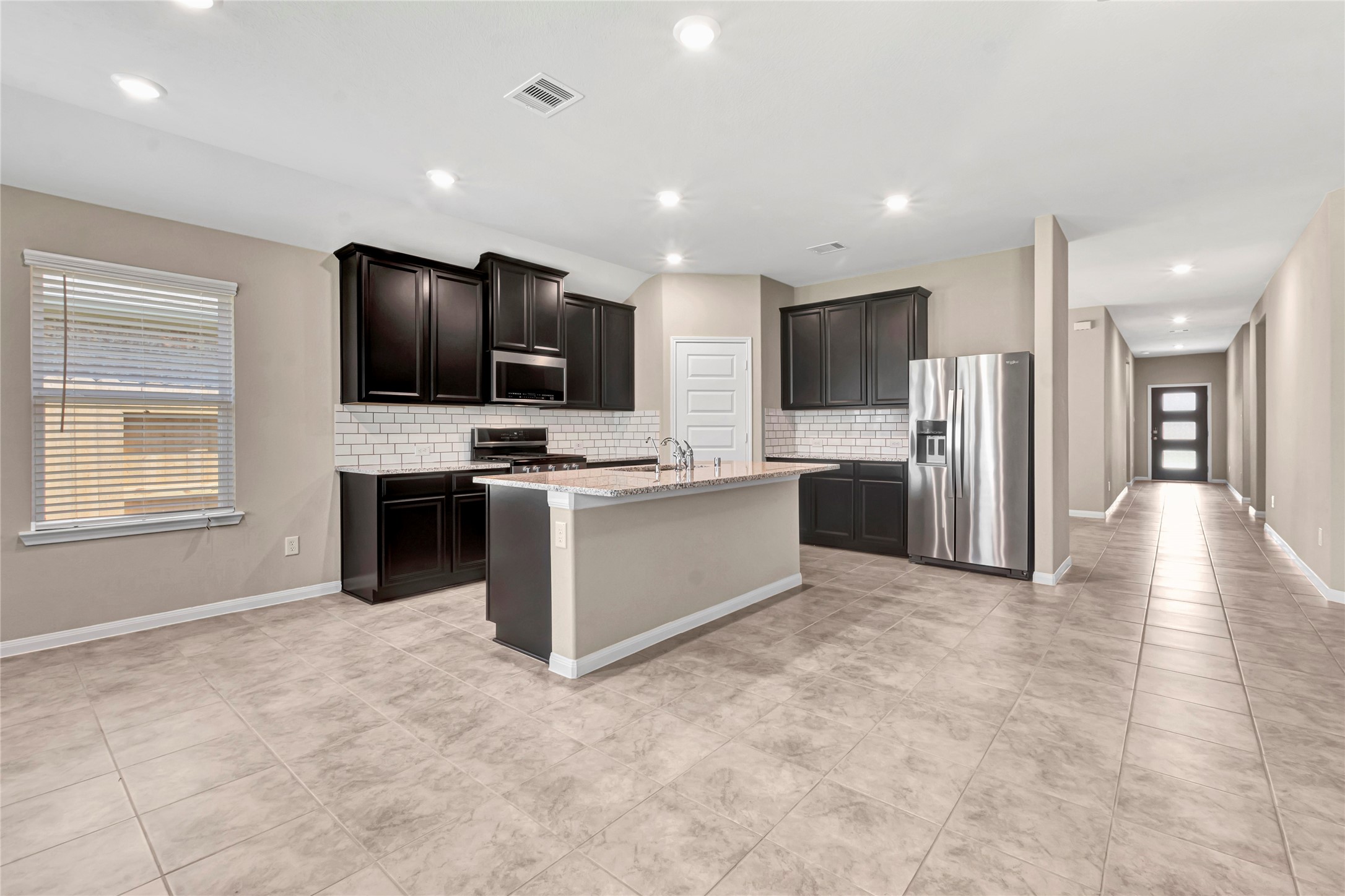 2702 Chancellor Rosenberg, TX 77471 - Photo 4 of 30 Photo is not of the actual home, but is an inspirational photo of builder’s model home and may depict options, furnishings, and/or decorator features that are not included