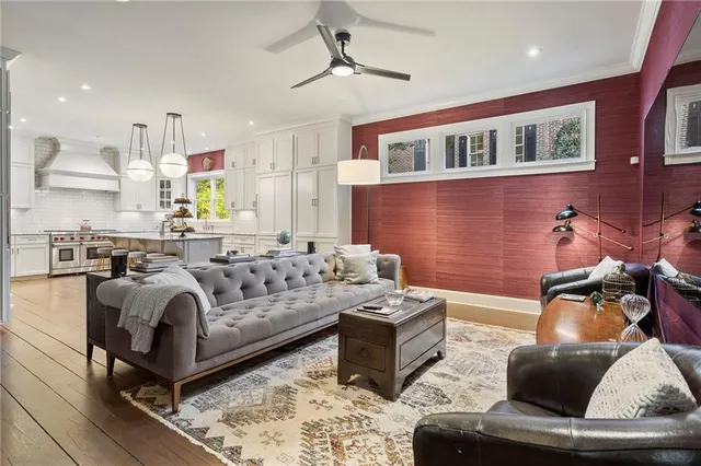 a view of a livingroom with workspace and a window