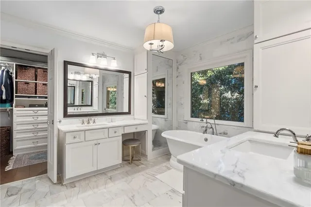 a bathroom with a shower sink and mirror