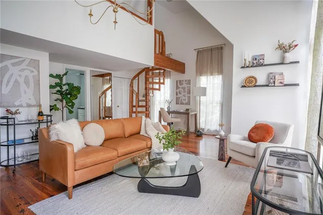 a bedroom with a bed and a night stand