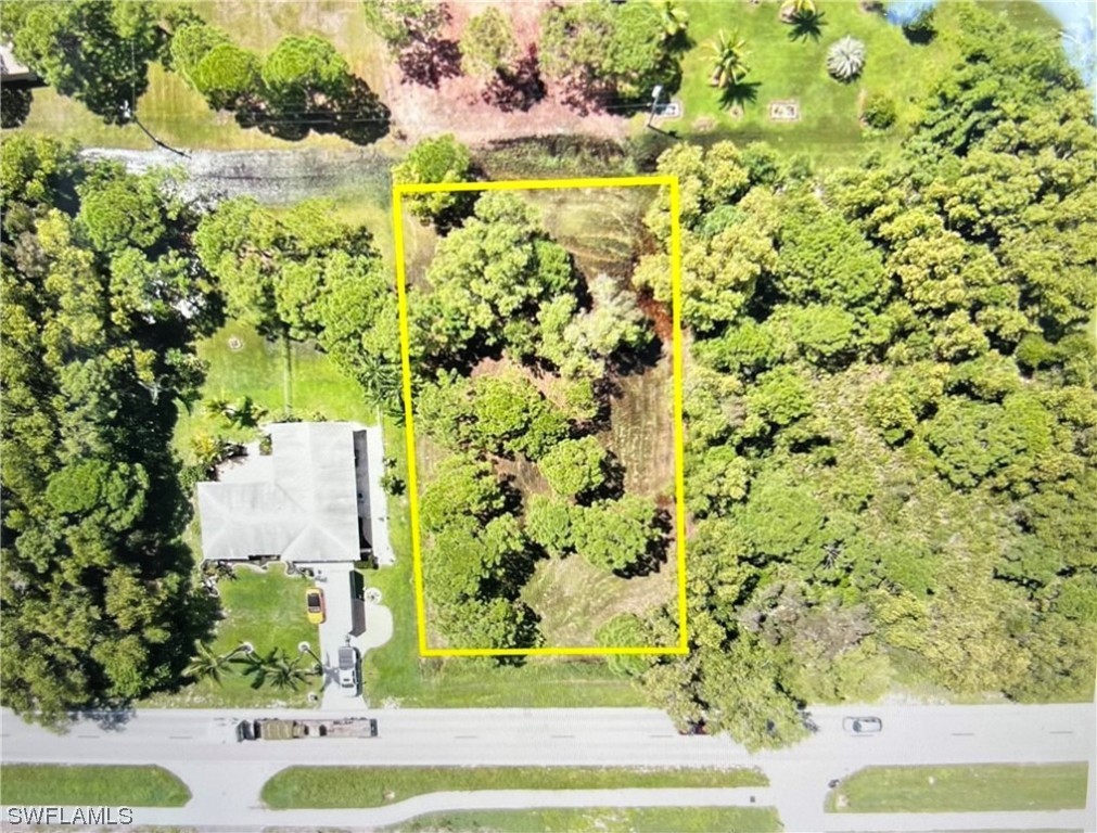 8757 Stringfellow Road St. James City, FL 33956 - Photo 4 of 5 a view of a yard with plants