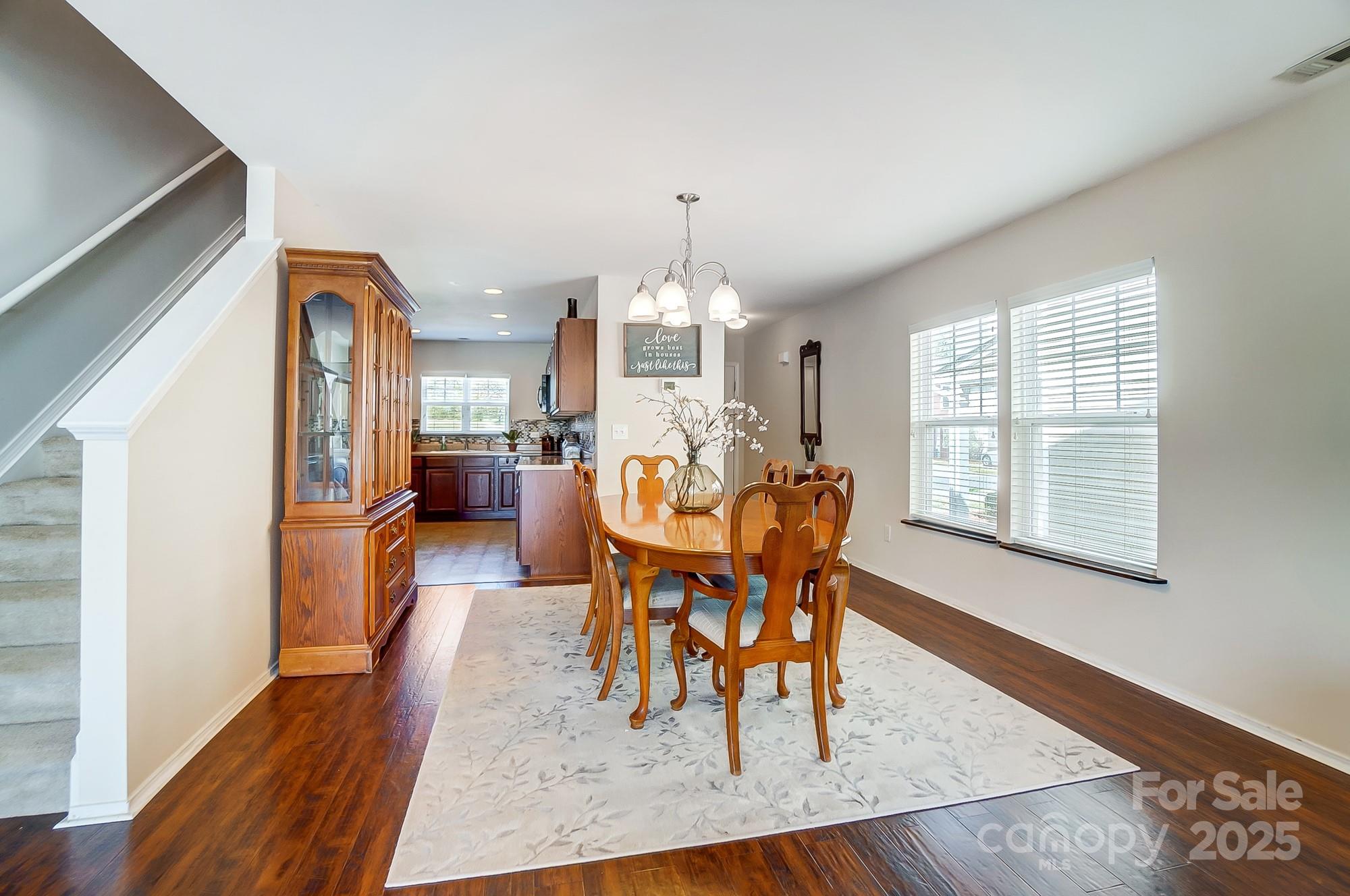 309 River Clay Road Fort Mill, SC 29708 - Photo 12 of 35 a view of a dining room with furniture and wooden floor