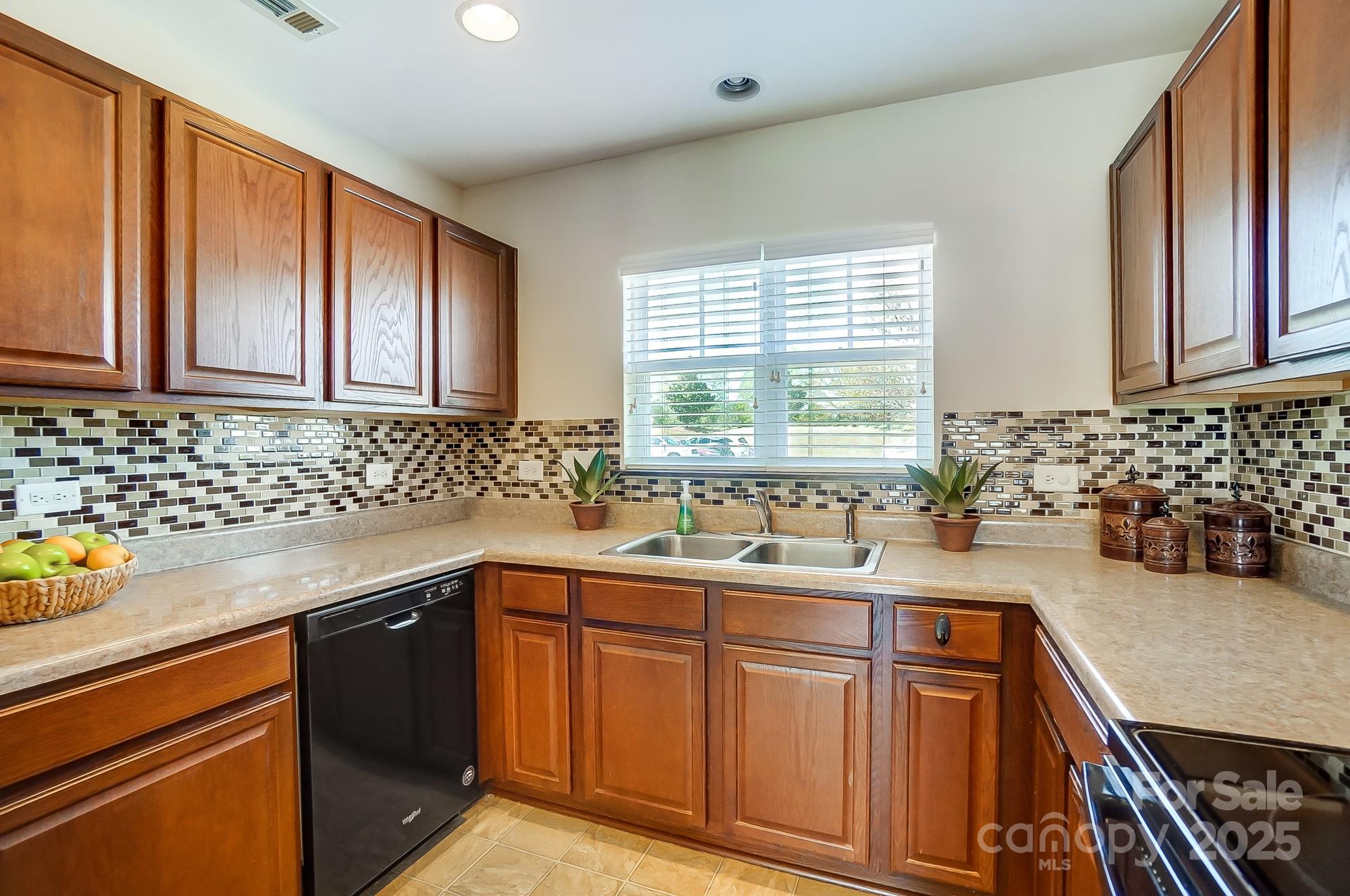 309 River Clay Road Fort Mill, SC 29708 - Photo 14 of 35 a kitchen with sink a window and cabinets