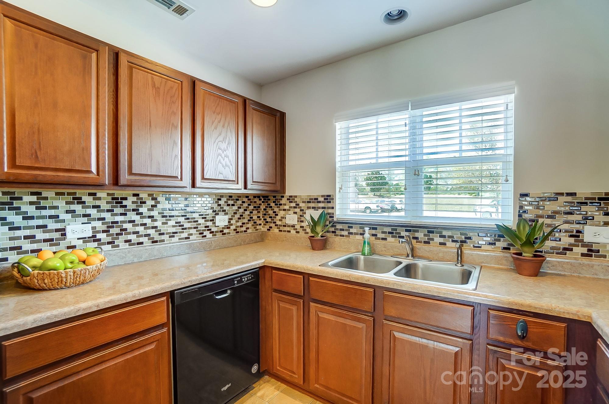 309 River Clay Road Fort Mill, SC 29708 - Photo 15 of 35 a kitchen with sink a window and cabinets