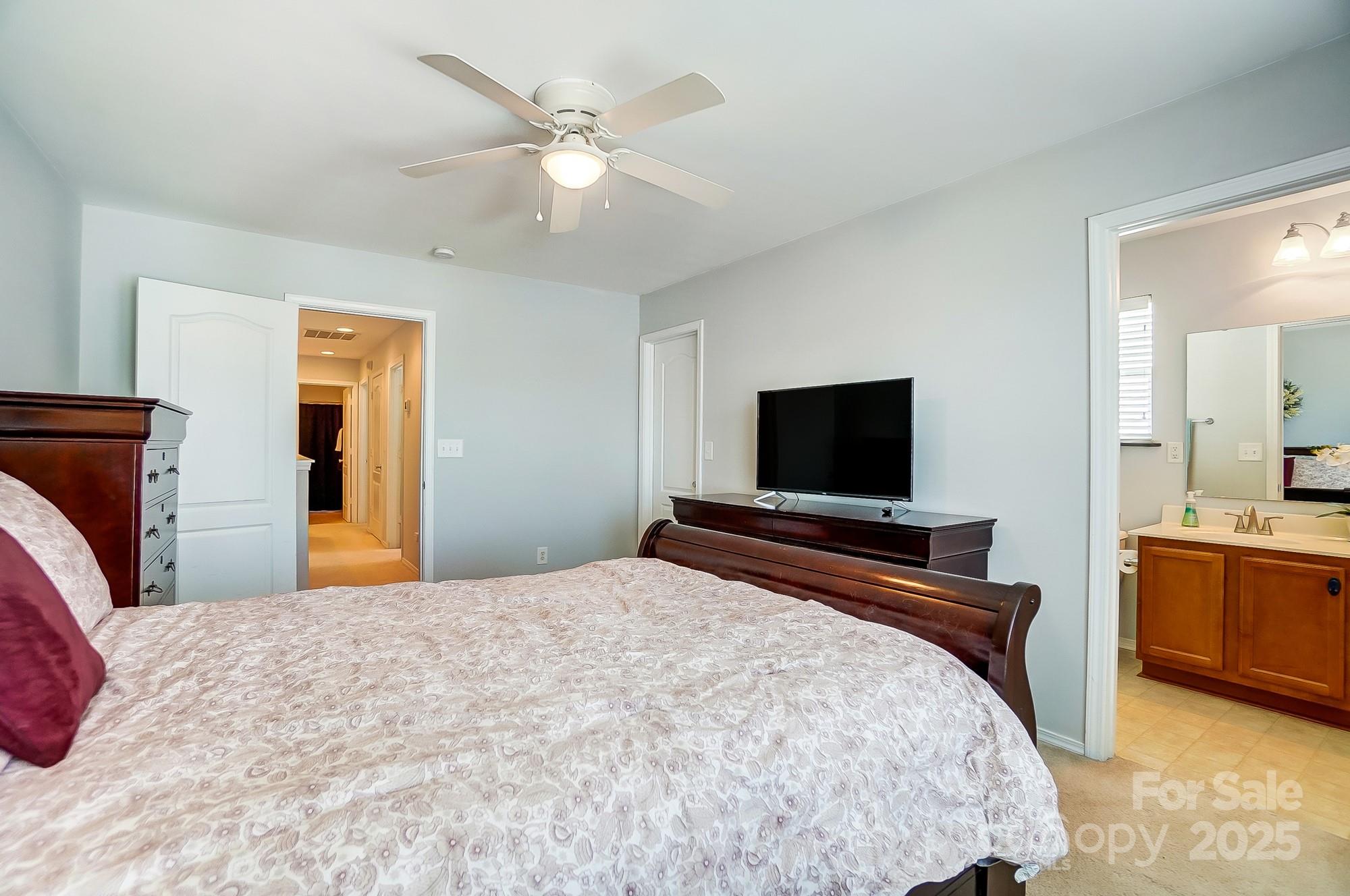 309 River Clay Road Fort Mill, SC 29708 - Photo 22 of 35 a bedroom with a bed and a flat screen tv