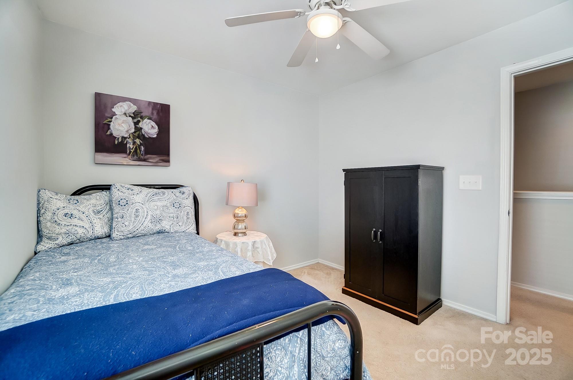 309 River Clay Road Fort Mill, SC 29708 - Photo 27 of 35 a bedroom with a bed and a dresser