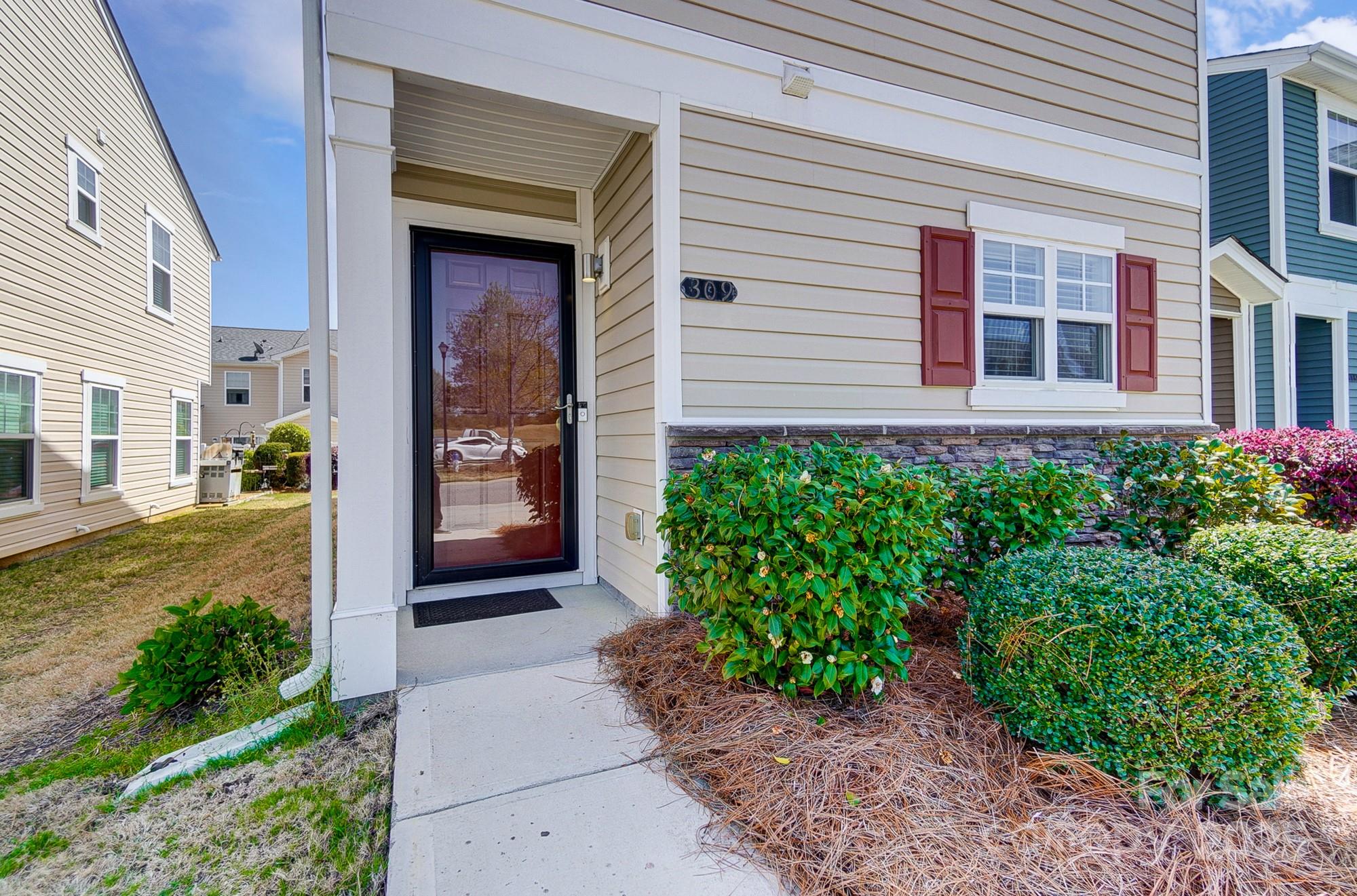 309 River Clay Road Fort Mill, SC 29708 - Photo 3 of 35 a front view of a house with a yard