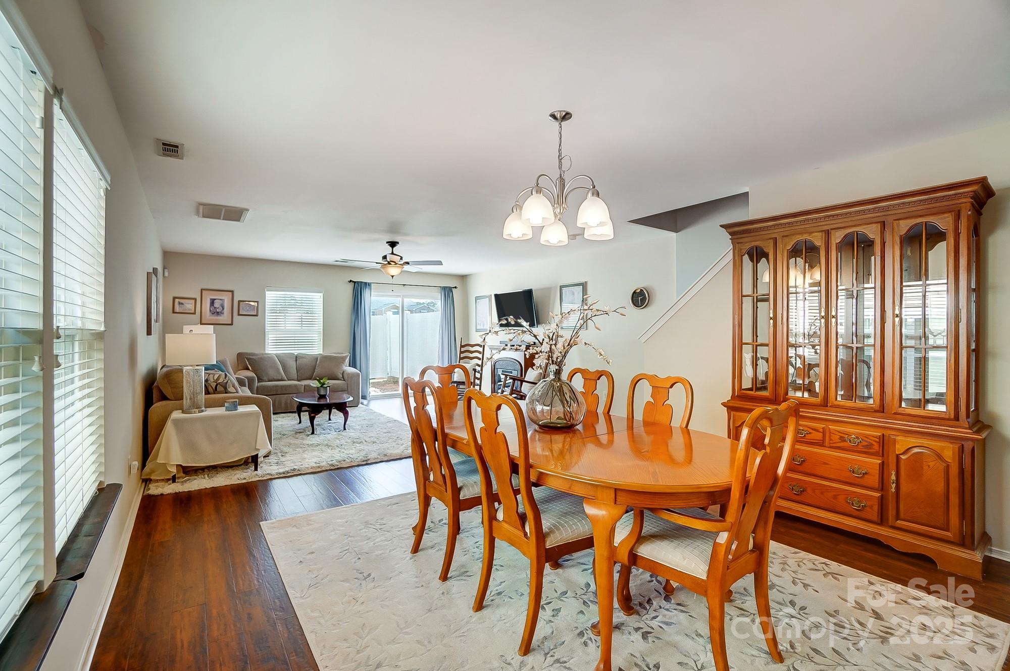 309 River Clay Road Fort Mill, SC 29708 - Photo 5 of 35 a view of a dining room with furniture window and wooden floor