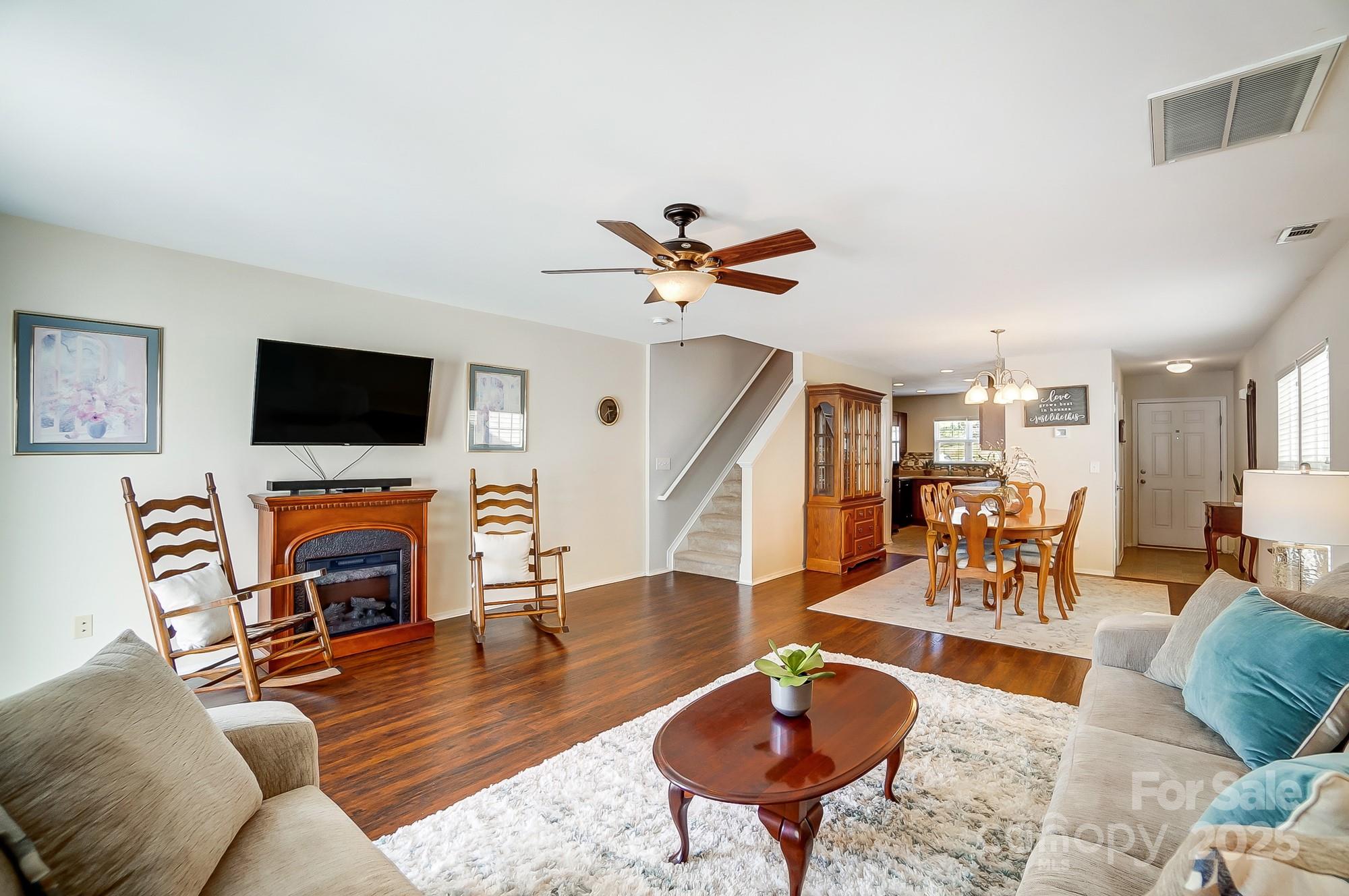 309 River Clay Road Fort Mill, SC 29708 - Photo 8 of 35 a living room with furniture a flat screen tv and a fireplace