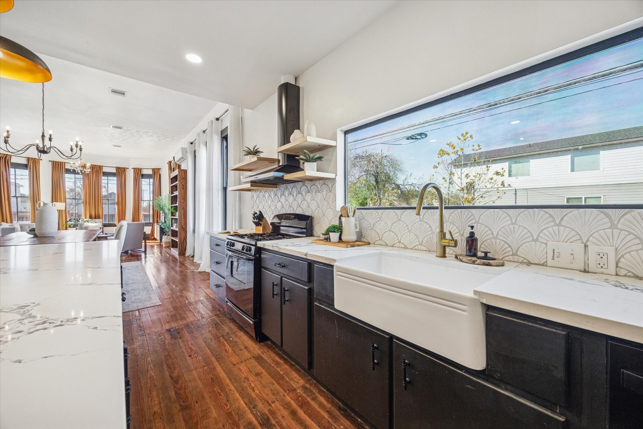 1920 Fulton Street Houston, TX 77009 - Photo 17 of 39 a kitchen with stainless steel appliances sink stove top oven and cabinets