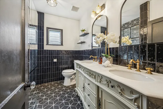 a bathroom with a sink and mirror