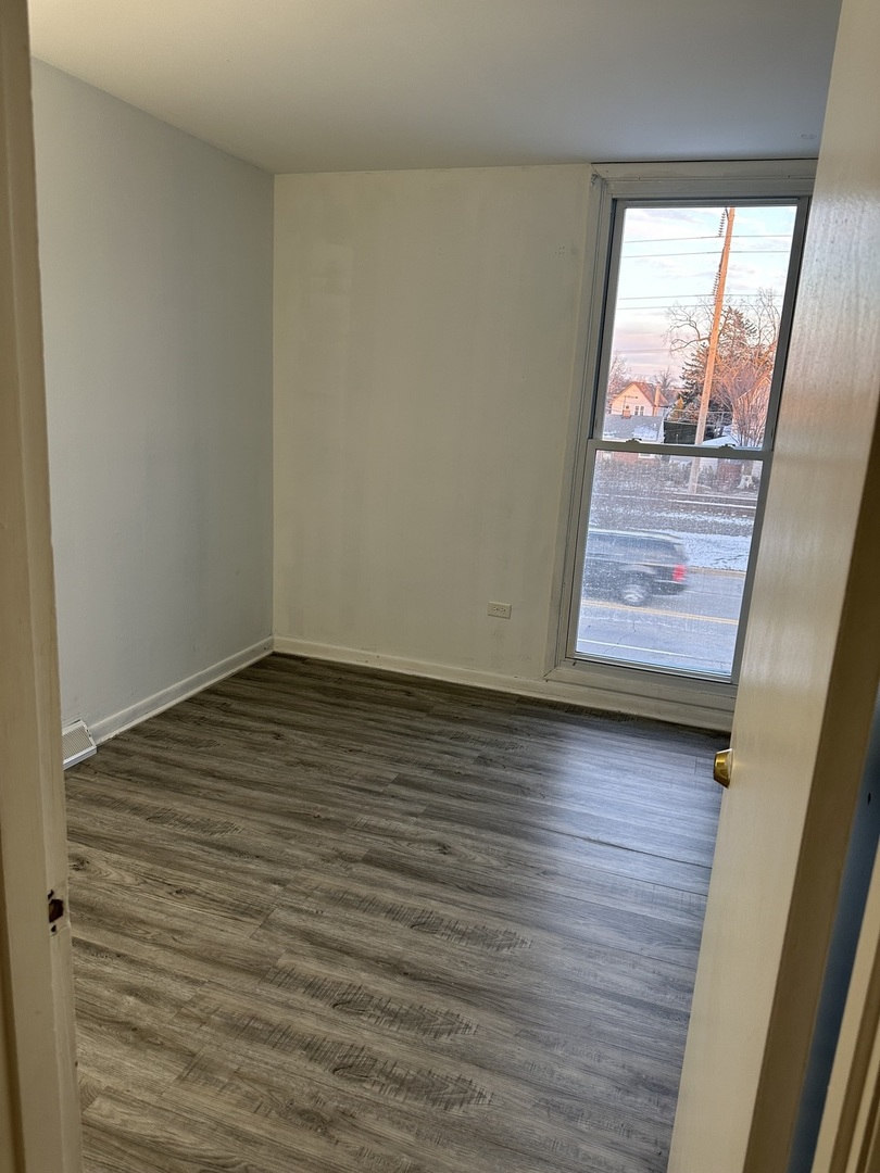 1876 Mannheim Road Des Plaines, IL 60018 - Photo 13 of 19 a view of an empty room and wooden floor
