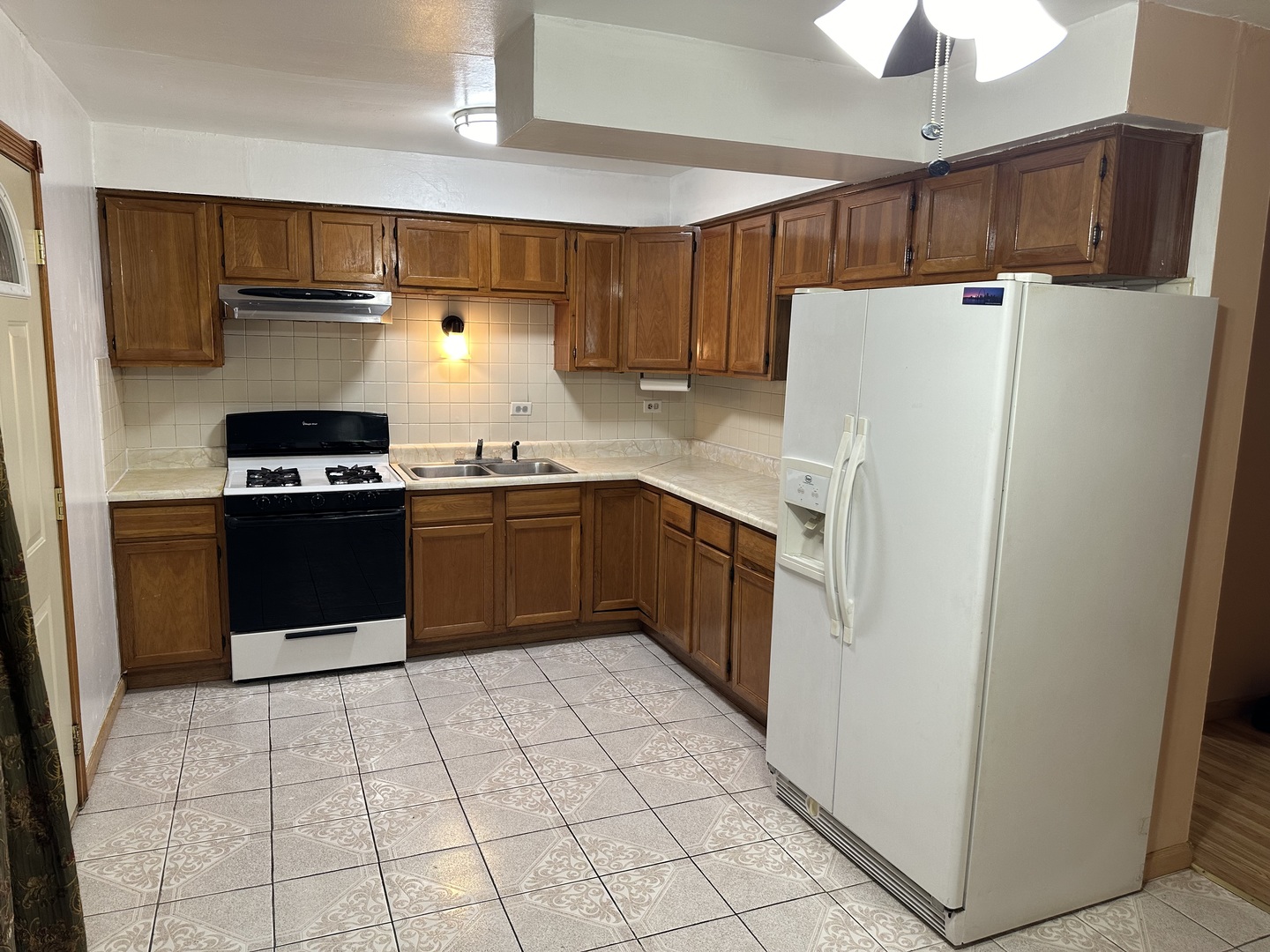 1876 Mannheim Road Des Plaines, IL 60018 - Photo 5 of 19 a kitchen with stainless steel appliances granite countertop a refrigerator sink and cabinets