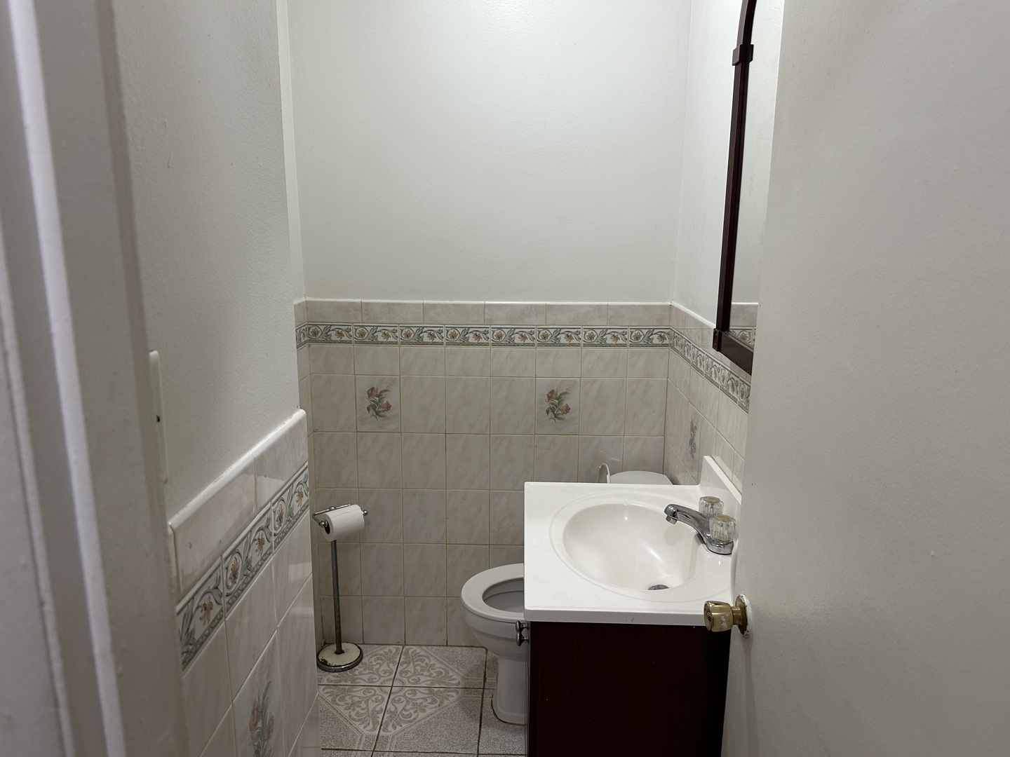 1876 Mannheim Road Des Plaines, IL 60018 - Photo 7 of 19 a bathroom with a sink toilet and mirror