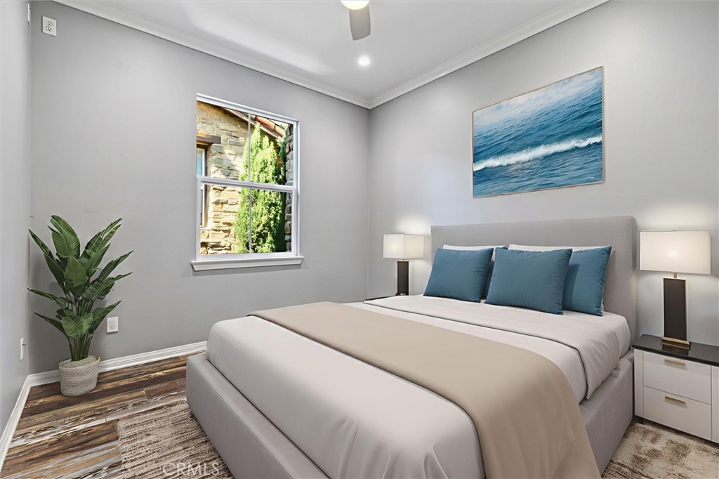 119 Jadestone Irvine, CA 92603 - Photo 14 of 27 a bedroom with a large bed and a potted plant