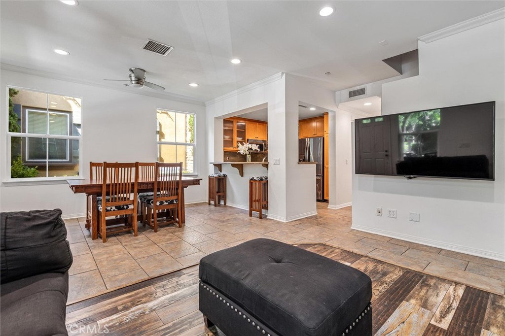 119 Jadestone Irvine, CA 92603 - Photo 4 of 27 a living room with furniture and a flat screen tv