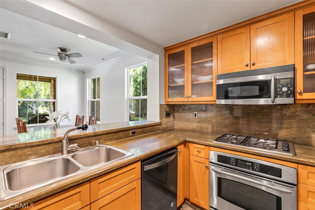 119 Jadestone Irvine, CA 92603 - Photo 9 of 27 a kitchen that has a sink and a stove