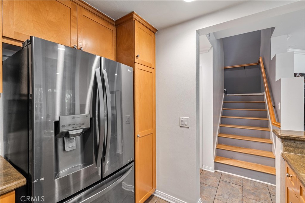 119 Jadestone Irvine, CA 92603 - Photo 10 of 27 a kitchen with metallic refrigerator and sink