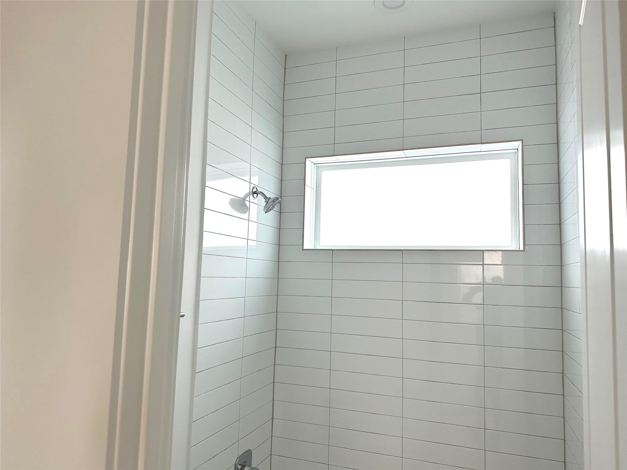 4619 Maxie Street Houston, TX 77007 - Photo 11 of 45 a bathroom with a window