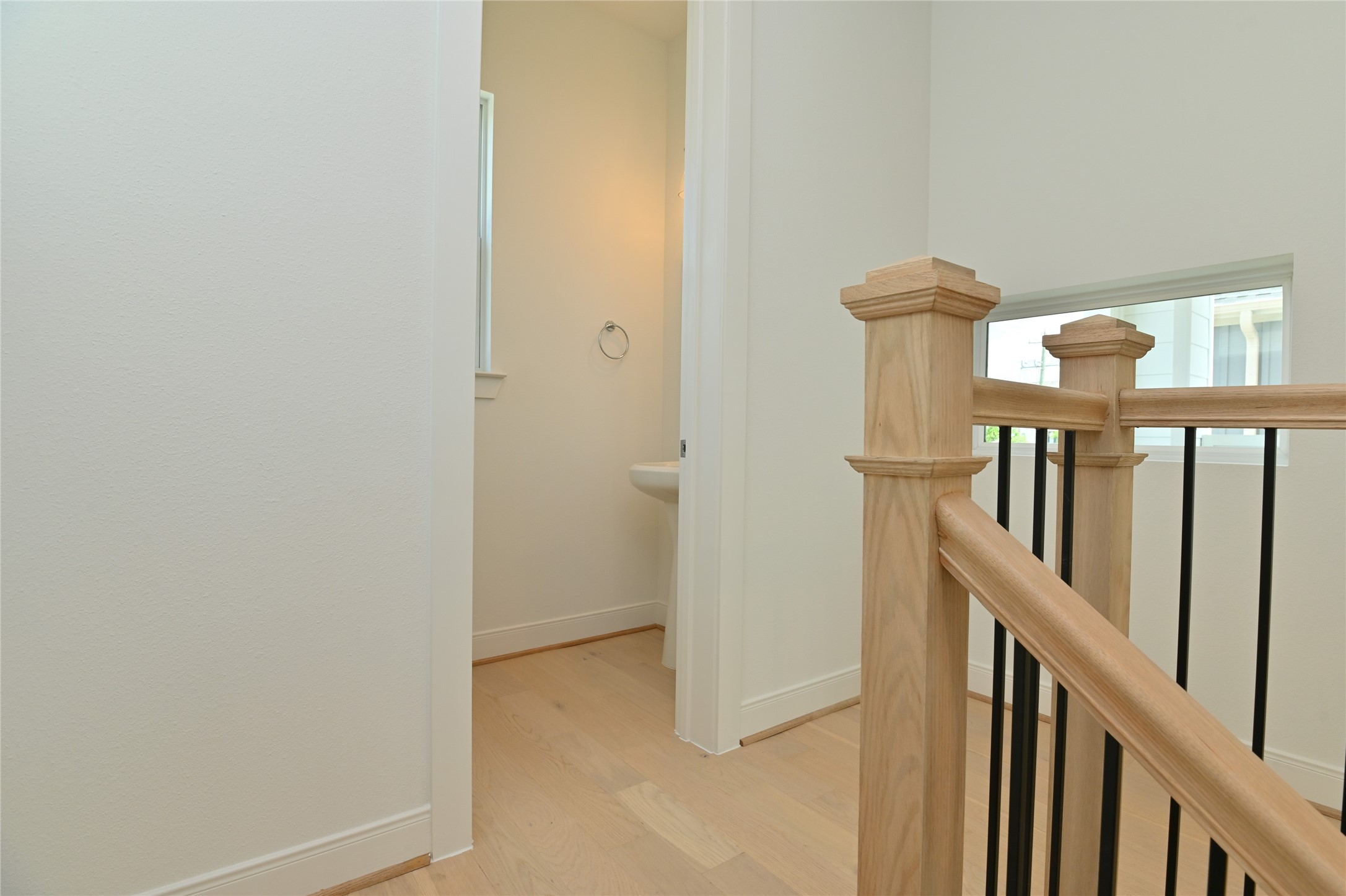 4619 Maxie Street Houston, TX 77007 - Photo 12 of 45 a view of staircase with railing and white walls