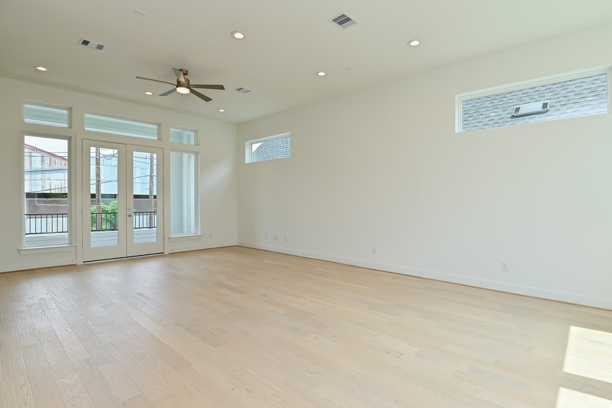 4619 Maxie Street Houston, TX 77007 - Photo 14 of 45 an empty room with wooden floor and windows