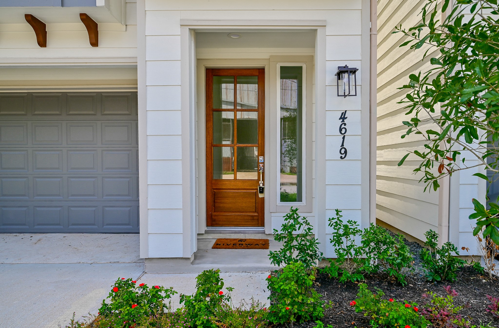 4619 Maxie Street Houston, TX 77007 - Photo 2 of 45 a vase with flowers sitting in front of a door