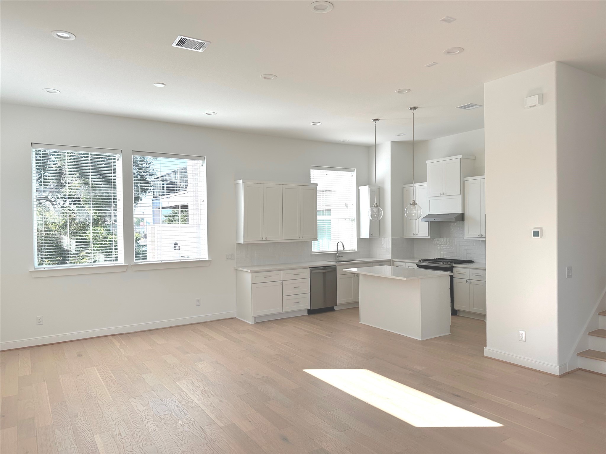 4619 Maxie Street Houston, TX 77007 - Photo 23 of 45 a large white kitchen with a large window