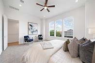 4619 Maxie Street Houston, TX 77007 - Photo 32 of 45 a spacious bedroom with a bed and large windows