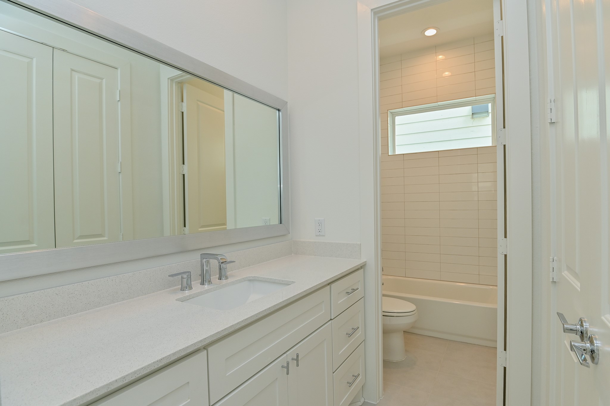 4619 Maxie Street Houston, TX 77007 - Photo 9 of 45 a bathroom with a granite countertop sink and a mirror