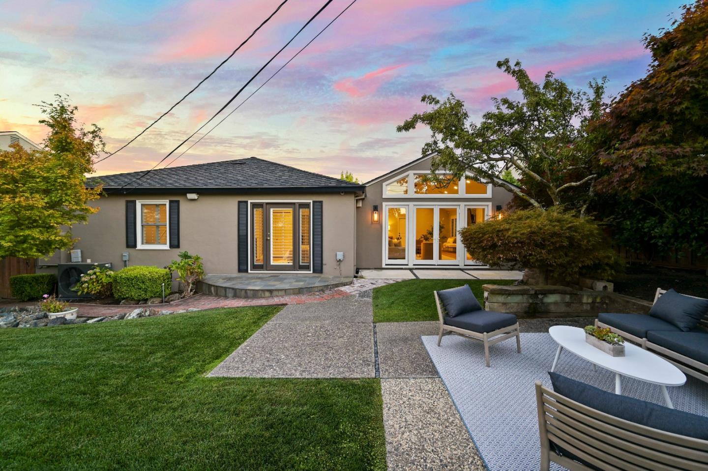 754 26th Avenue San Mateo, CA 94403 - Photo 13 of 57 a front view of a house with a yard porch and outdoor seating