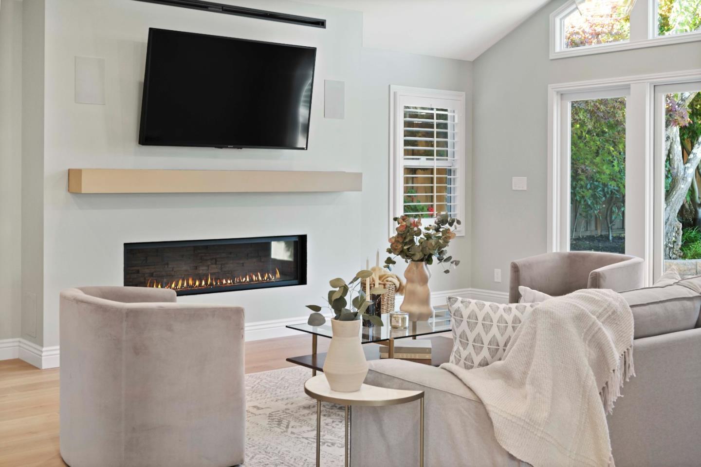 754 26th Avenue San Mateo, CA 94403 - Photo 26 of 57 a living room with furniture a fireplace and a flat screen tv