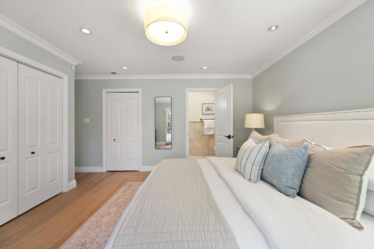 754 26th Avenue San Mateo, CA 94403 - Photo 35 of 57 a spacious bedroom with a bed and a painting